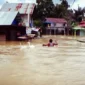 Banjir dua meter di kecamatan Simpang Empat Kabupaten Banjar yang terjadi pada awal tahun 2022 (foto: Ndi, www.riceknews.com)