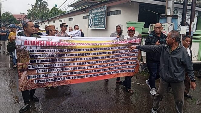 
 BABAK Kalsel Gelar Aksi, Desak Polda Usut Dugaan Penghalangan Proyek Jalan Usaha Tani di HSU