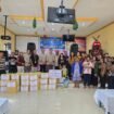 Penyerahan bantuan oleh PWI Kotabaru dan PT PTK di Gereja PDL Megasari Desa Megasari Kecamatan Pulau Laut Utara.